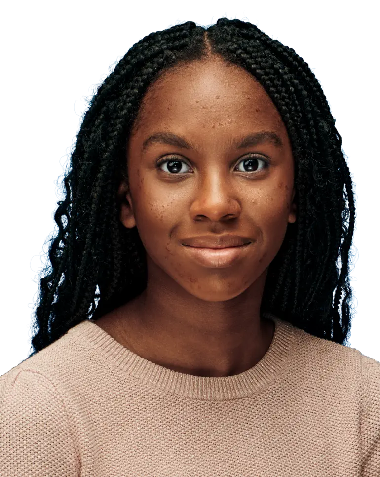 Photo of a young woman wearing a pink shirt smiling. 
