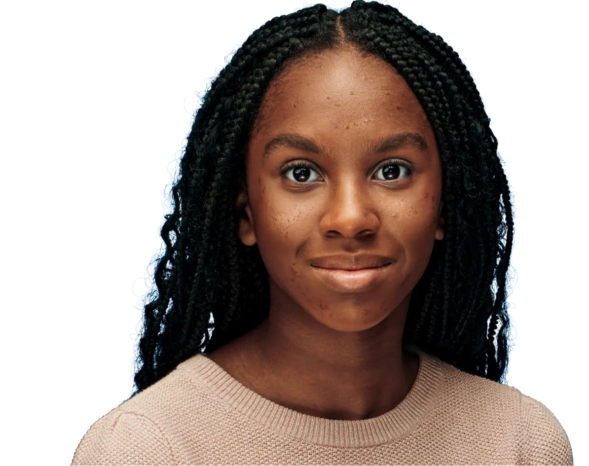 Photo of a young woman wearing a pink shirt smiling. 
